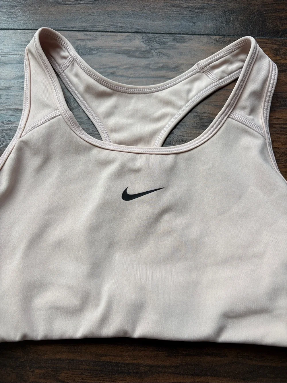Nike Women’s light beige Racerback Sports Bra with Black Swoosh